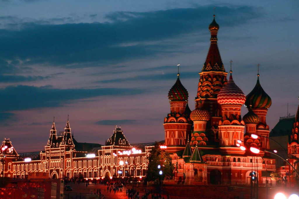 St Basil's Cathedral and Red Square in Moscow illuminated at dusk with vibrant evening sky Wallpaper
