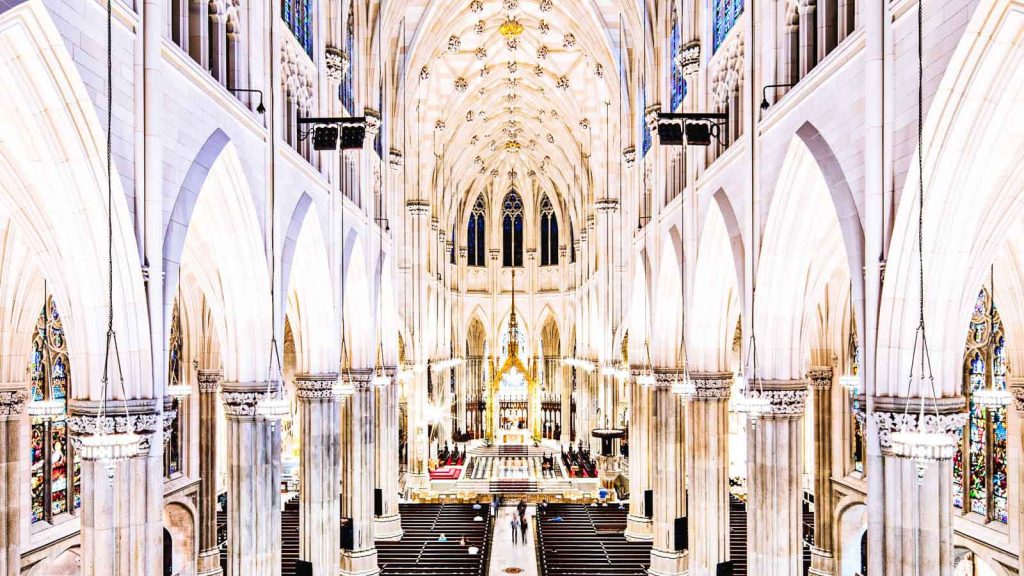 St. Patrick's Cathedral NYC Neo-Gothic interior vaulted ceilings white columns stained glass wallpaper