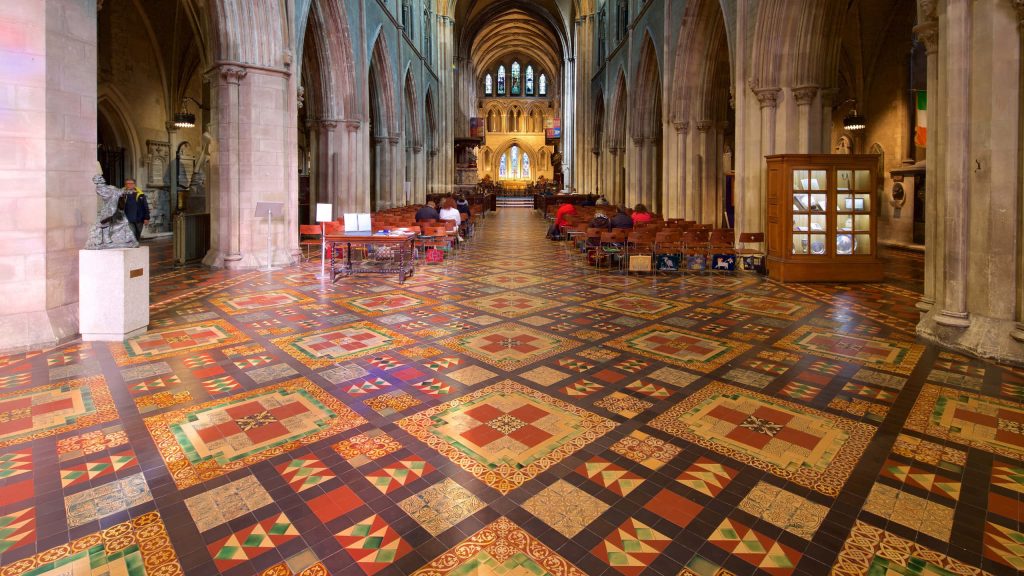St Patricks Cathedral interior with vibrant geometric tile floor and vaulted gothic arches wallpaper