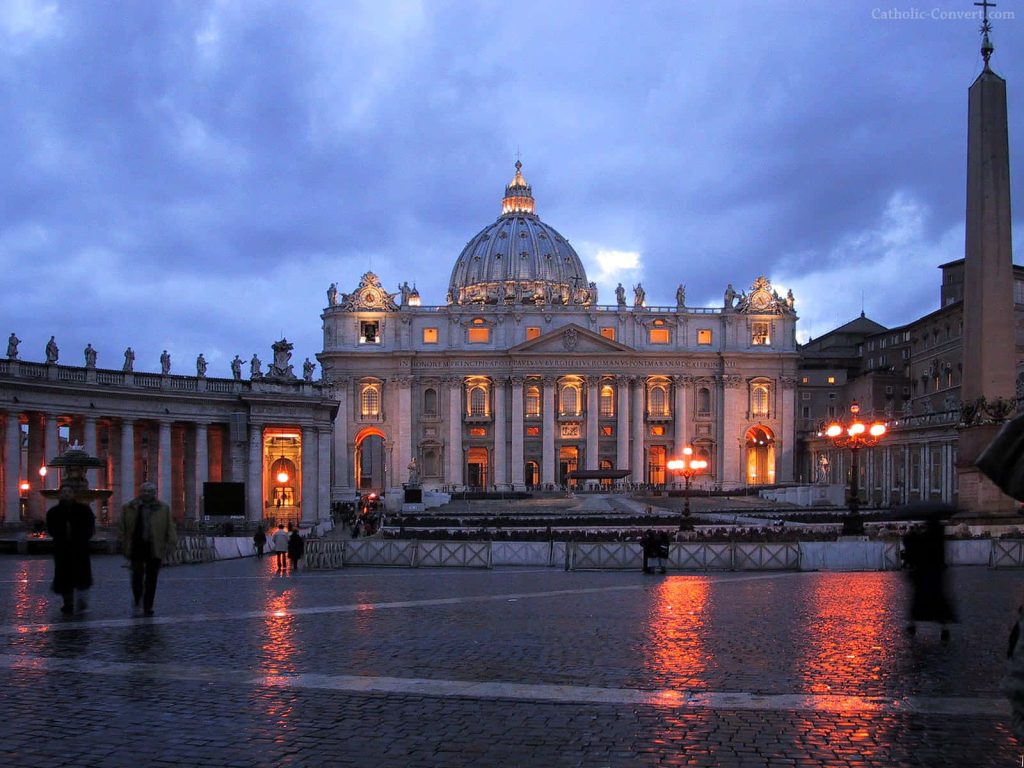 St Peters Basilica at dusk with warm golden light reflecting on wet cobblestones Vatican City Wallpaper