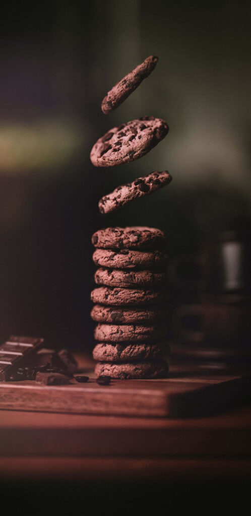 Coffee Confections: A Tempting Tower of Double Chocolate Cookie Delights Wallpaper