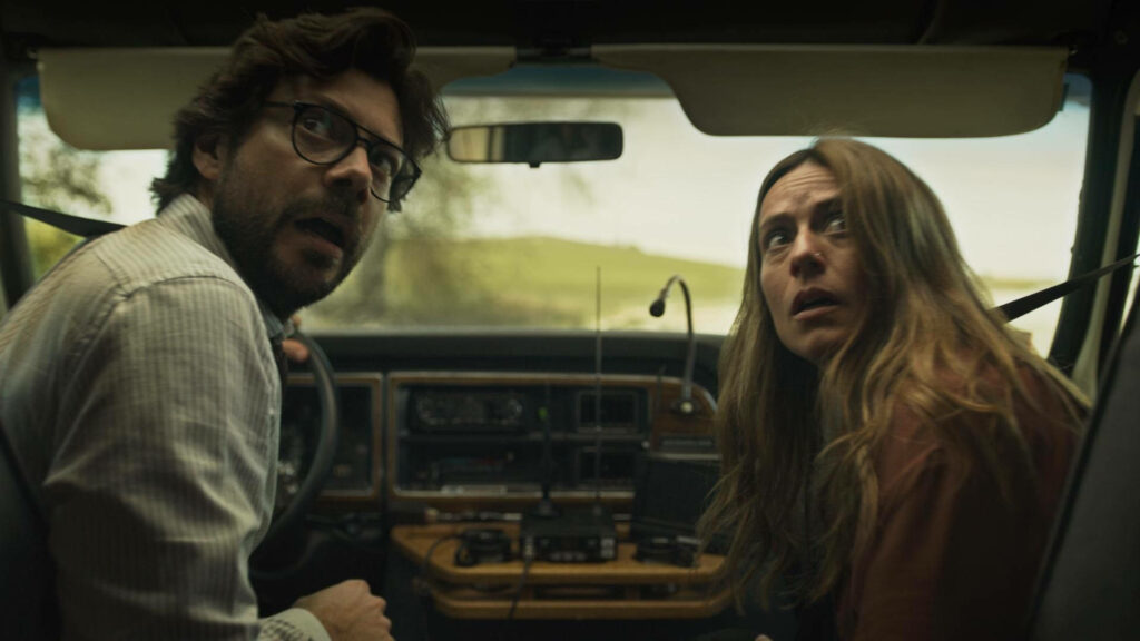 Escape in Love: Professor and Raquel's Thrilling Getaway amidst Authority Pursuit from Money Heist Wallpaper