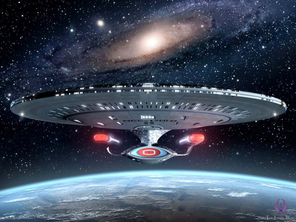 Star Trek Starship Soars Above Earth: Mesmerizing Space Wallpaper