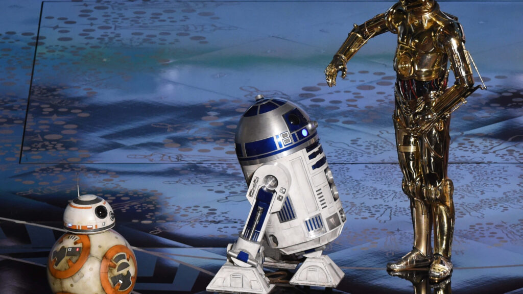 BB-8 R2-D2 and C-3PO standing together on futuristic blue floor Star Wars droids wallpaper background