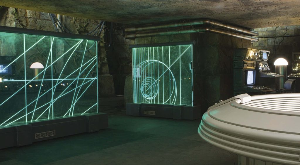 Star Wars Resistance base command center wallpaper with rocky textures and glowing green displays
