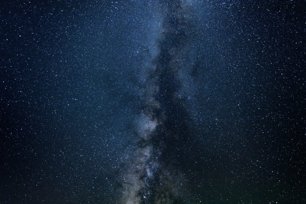Stunning high resolution Milky Way wallpaper with glowing stars and deep blue cosmic clouds background