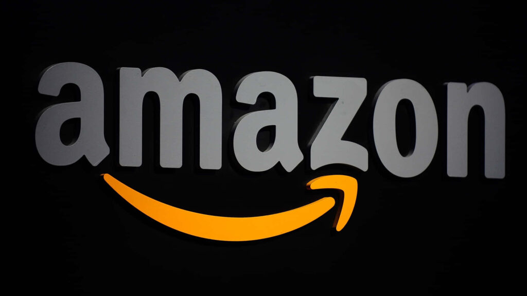 Orange Arrow Against Dark Backdrop: Gray Amazon UK Logo Wallpaper