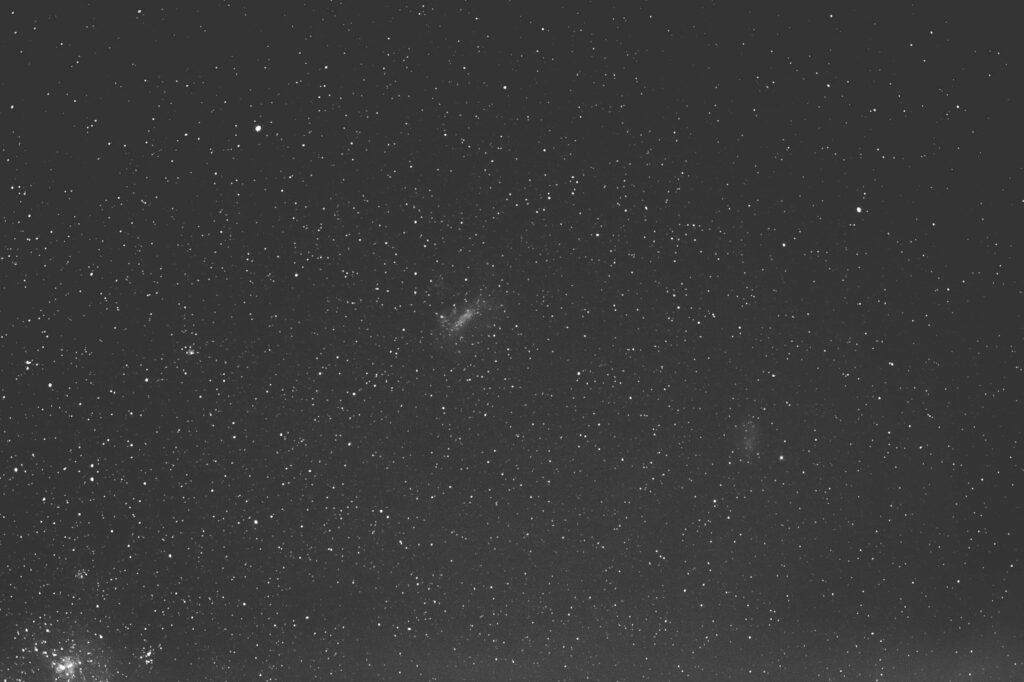 Starry night sky wallpaper showcasing a vast black space filled with twinkling stars.