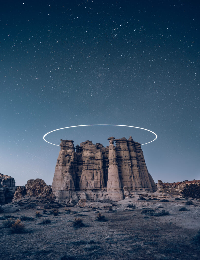 Celestial Serenity: Jaw-Dropping Desert Rock Formation under a Captivating Night Sky, Enhancing your Iphone 7 Plus Space-themed Background Wallpaper