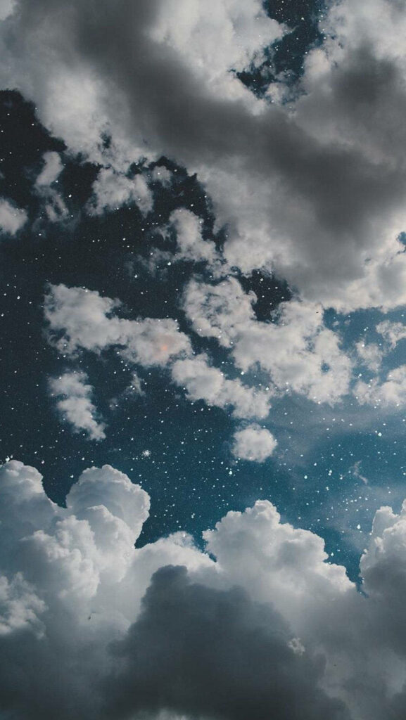 Stellar Skyline: Mesmerizing Dark Blue Aesthetic Iphone 11 Background with Serene White Clouds and Shimmering Stars Wallpaper