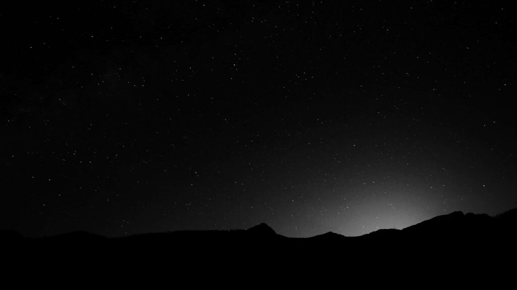 Starry Night and Mountains in Dark Background Wallpaper