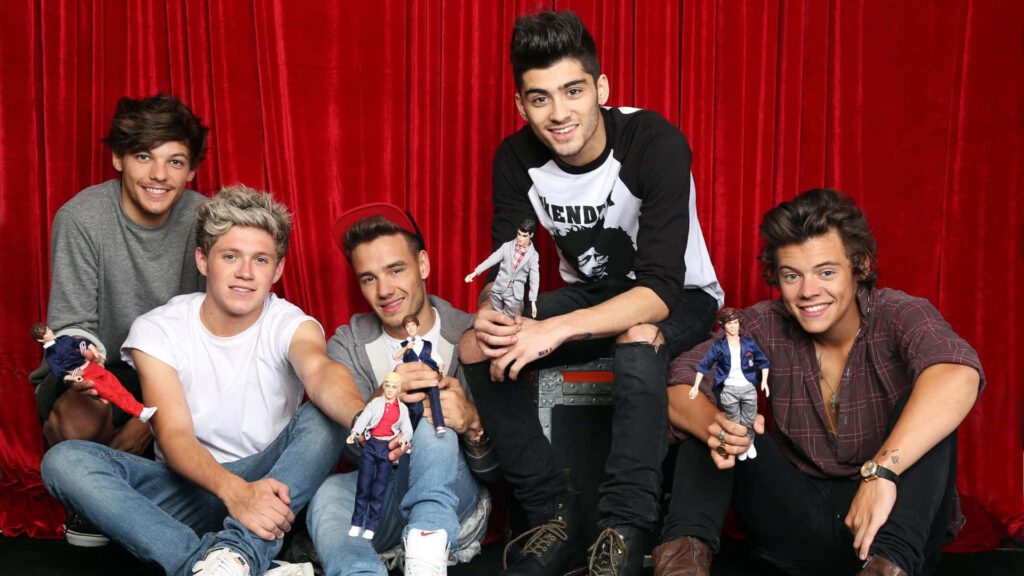 Jam Out with One Direction: A Sleek Laptop Wallpaper for Music Lovers