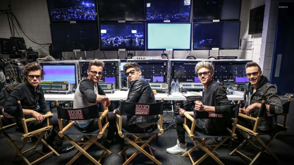 One Direction Members Pose Confidently in Movie Director's Chairs Wallpaper