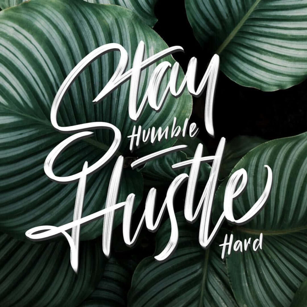 Stay Humble Hustle Hard Wallpaper: Elegant Script on Green Leaves
