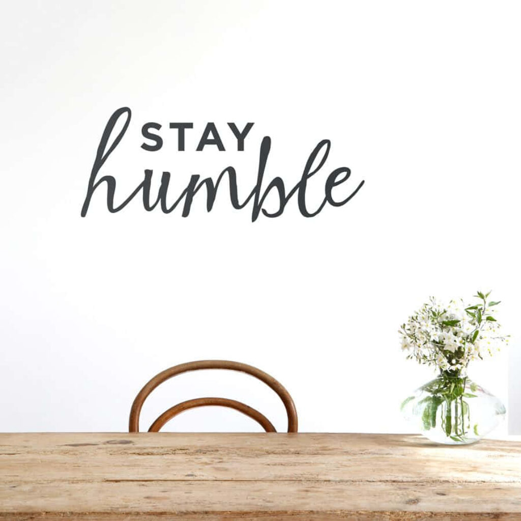 Minimalist Stay Humble Wallpaper with Elegant Script & Floral Decor