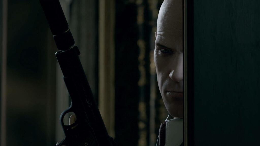 Silent Shadows: Agent 47 Lurks in the Shadows, Ready to Strike Wallpaper