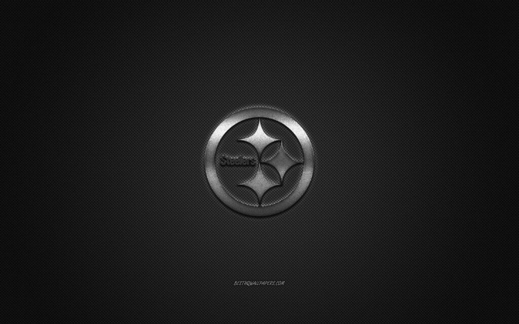 Pittsburgh Steelers: Iconic Silver Emblem Illuminating Pittsburgh's Football Pride on Carbon Fiber Canvas Wallpaper