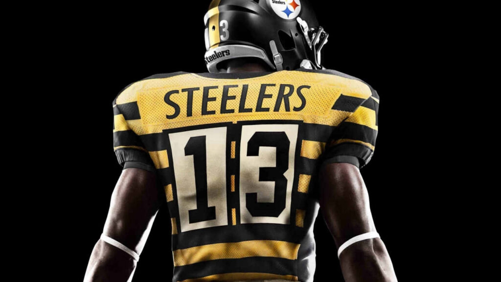 HD 720p Steelers Rugby Player Wallpaper: Bold Black & Yellow Design