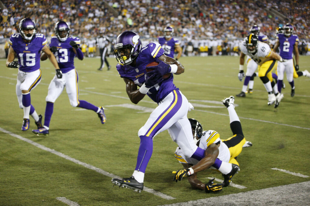Stefon Diggs in Action: Intense Football Game Wallpaper Background