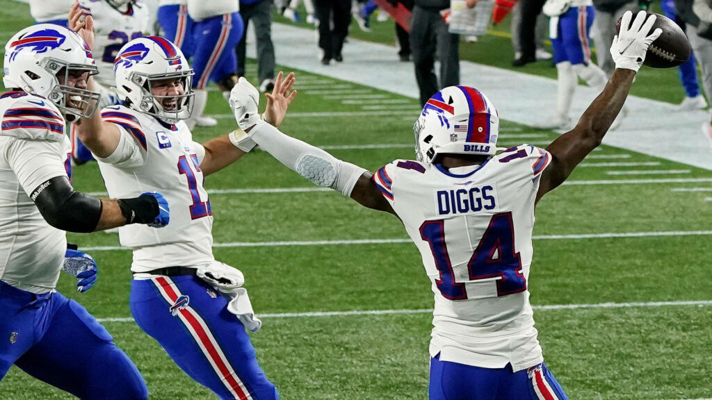 Stefon Diggs Buffalo Bills touchdown celebration with teammates vibrant NFL football action wallpaper