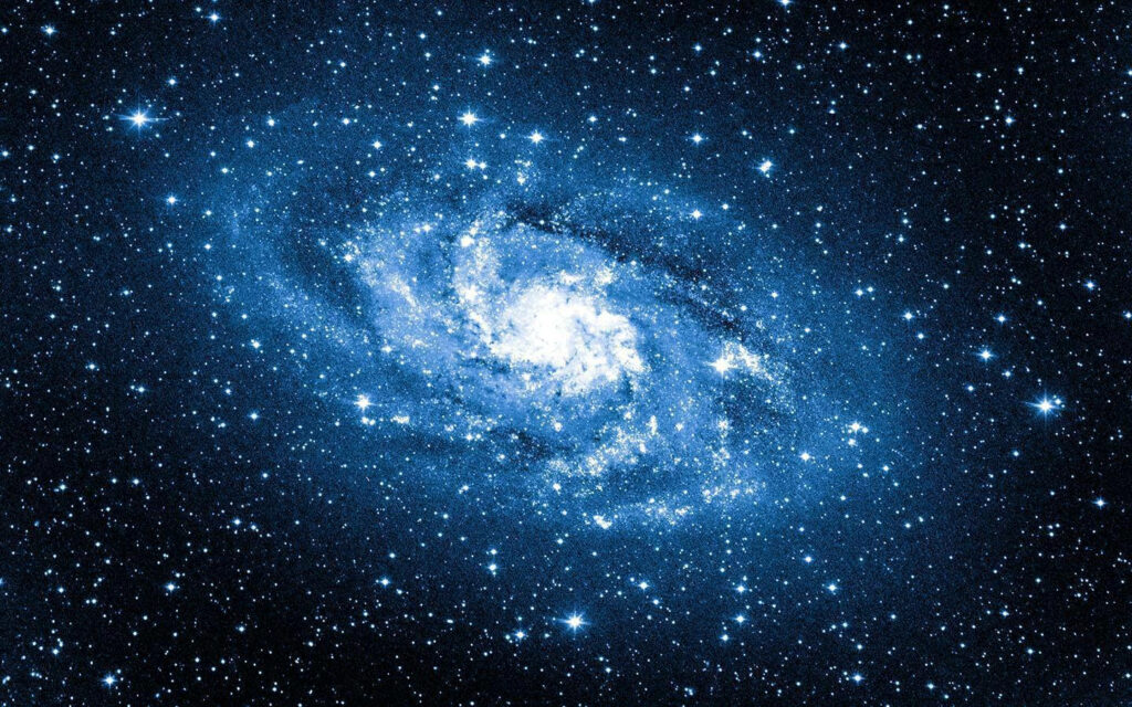 The Spectacular Realm: Capturing the Enchanting Expanse of a Celestial Blue Galaxy Amidst a Dazzling Constellation Wallpaper