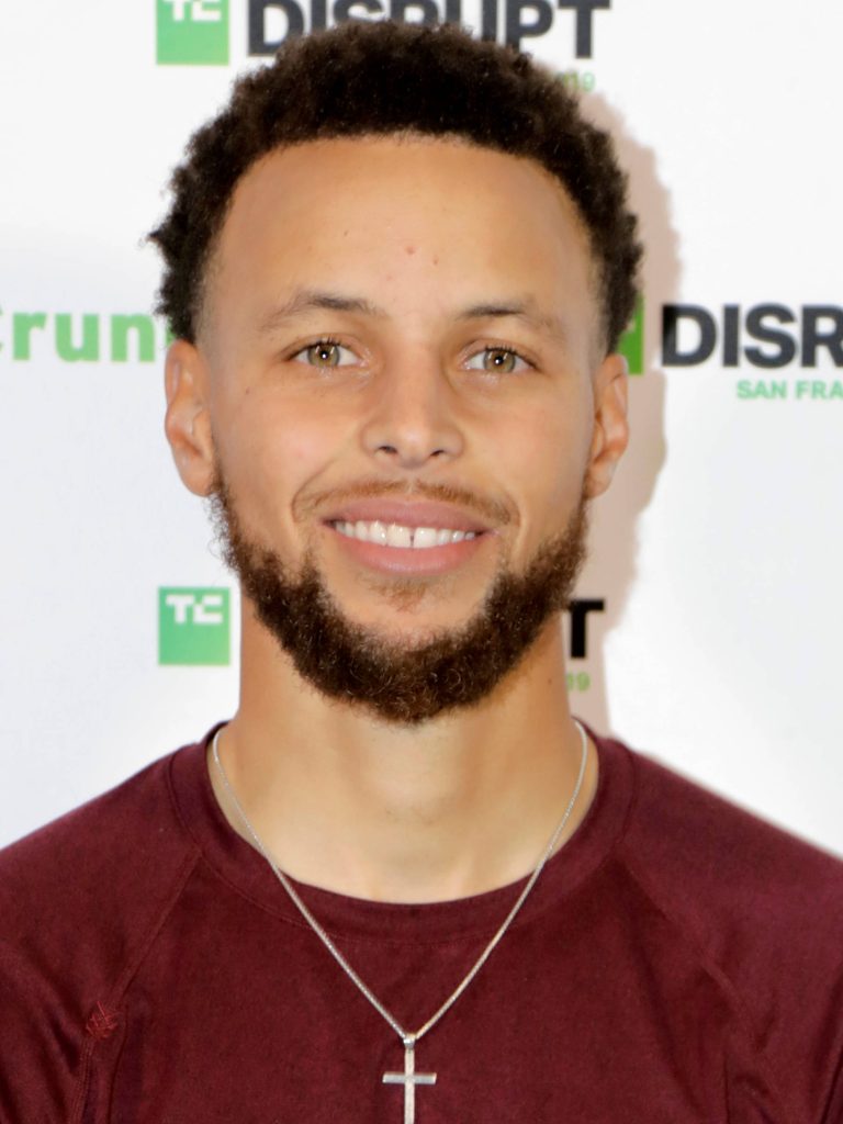 Stephen Curry smiling portrait wearing maroon crewneck and cross necklace at TechCrunch Disrupt Wallpaper