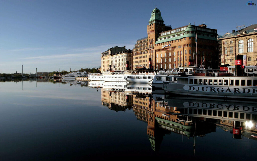 Serene Stockholm Wallpaper: Historic Buildings Reflected on Water