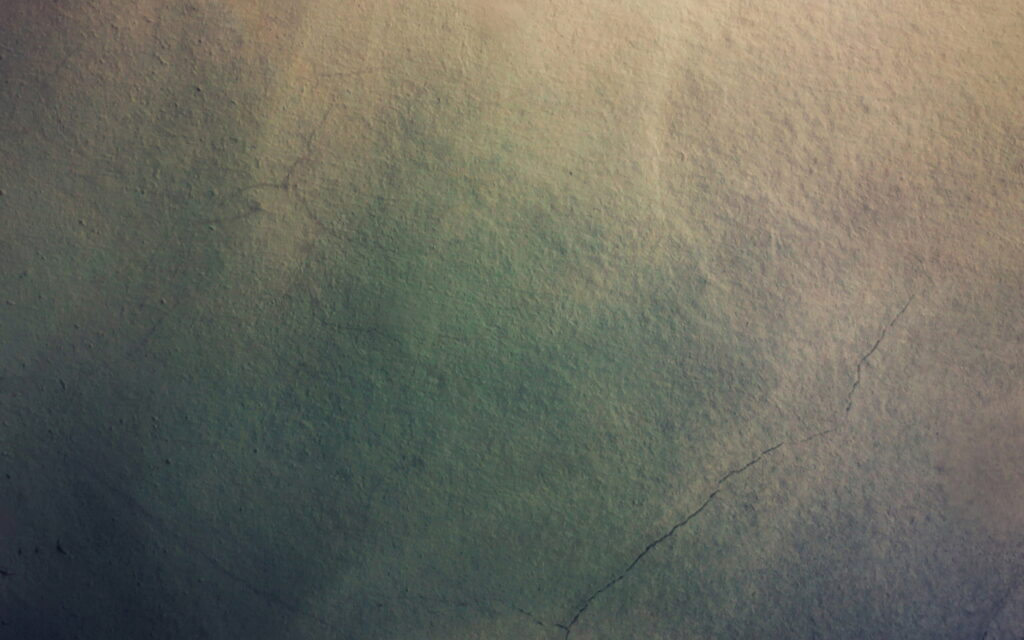 Shadows of Stone: A Moody QHD Wallpaper with Grungy Gray Wall Texture