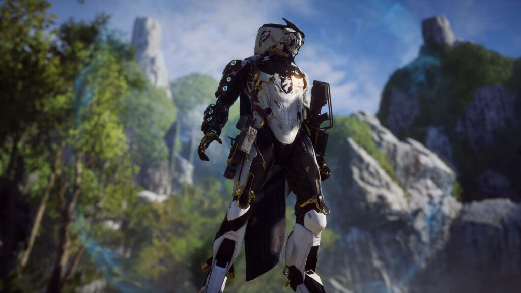 Storm Javelin exosuit from Anthem game in heroic pose with cliffs and lush green landscape Wallpaper