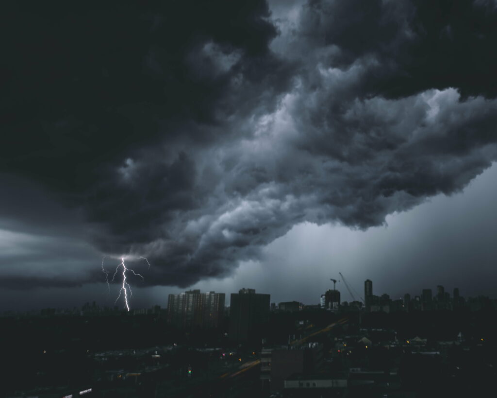 Stormy Cityscape HD Wallpaper: Lightning & Turbulent Sky Background