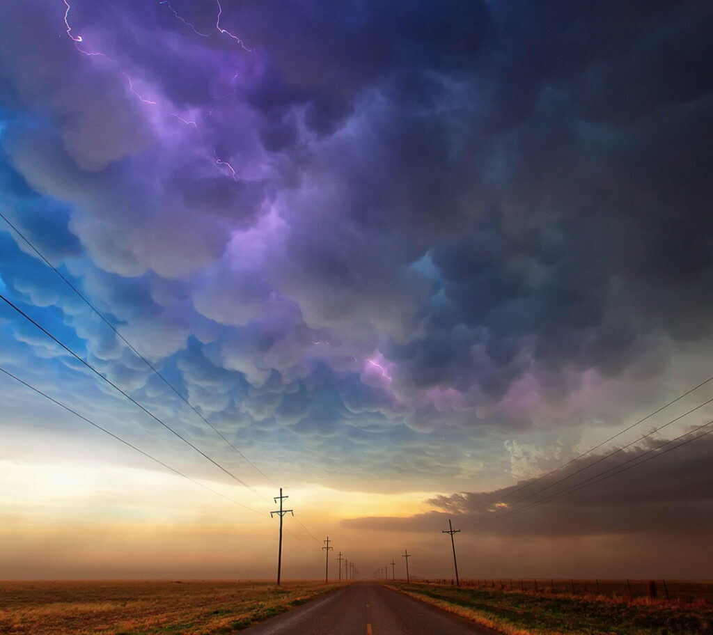 Dramatic Texas Sky Wallpaper: Vibrant Lightning Over Rural Road