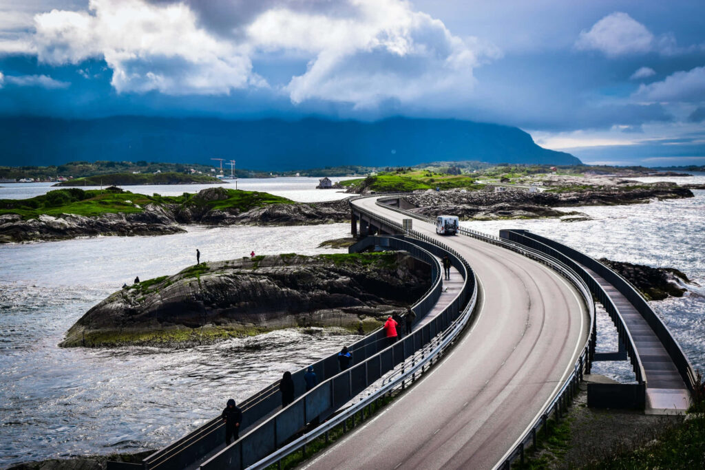 Storseisundet Bridge: Scenic People Walk in Ocean Beauty Wallpaper