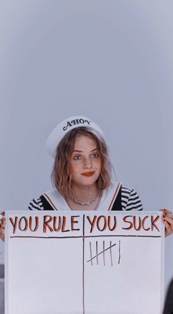 Stranger Things Robin Buckley in Scoops Ahoy uniform holding You Rule You Suck sign wallpaper
