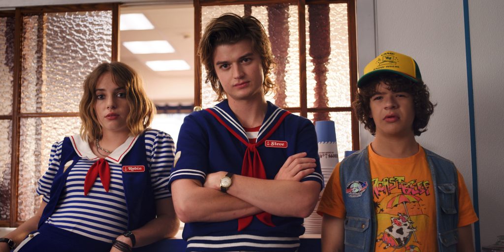 Stranger Things wallpaper showing Robin Steve Dustin Scoops Ahoy uniforms Starcourt Mall scene