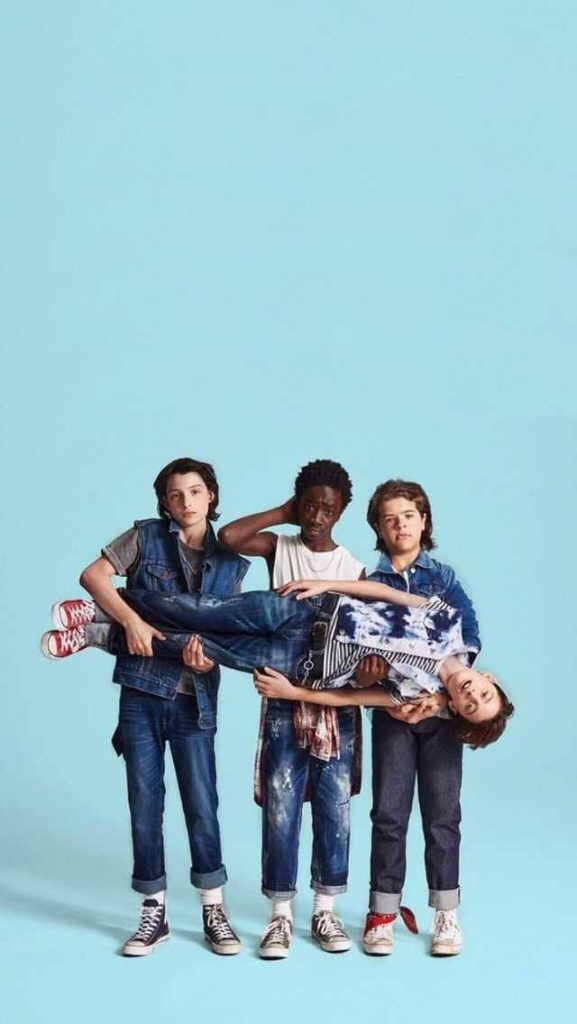 Stranger Things cast Finn Wolfhard Caleb McLaughlin Gaten Matarazzo Noah Schnapp studio pose wallpaper