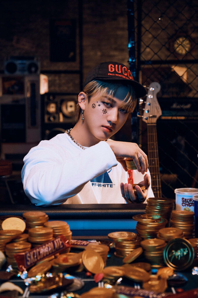 Stray Kids Changbin confidently preparing spotlight gold coins snacks dynamic wallpaper background
