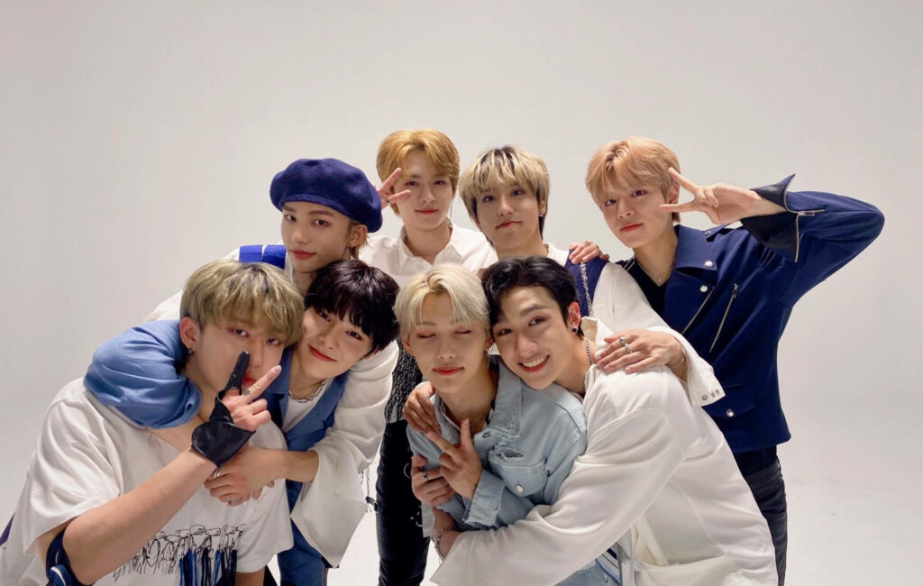 Stray Kids eight members posing in bright studio showcasing friendship and energetic vibe wallpaper