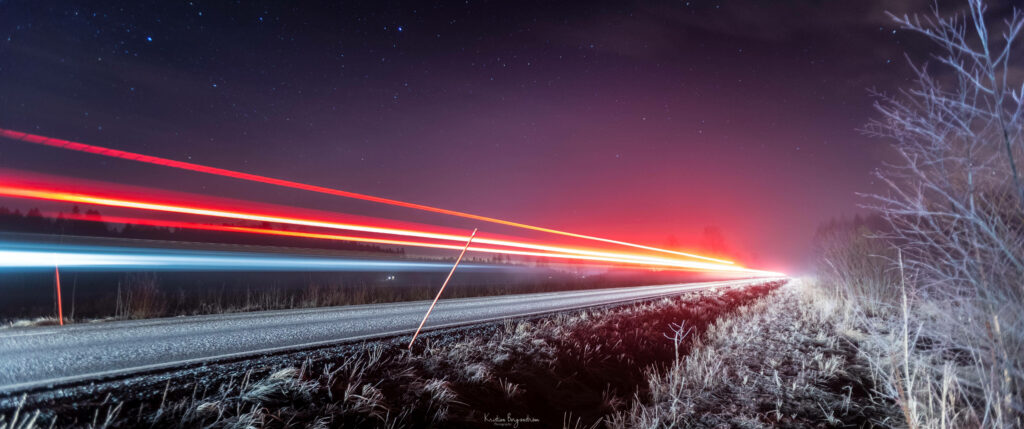 Nightscape: Mesmerizing Road with Blurring Red Lights - Captured in Stunning 4k Ultra Widescreen Wallpaper