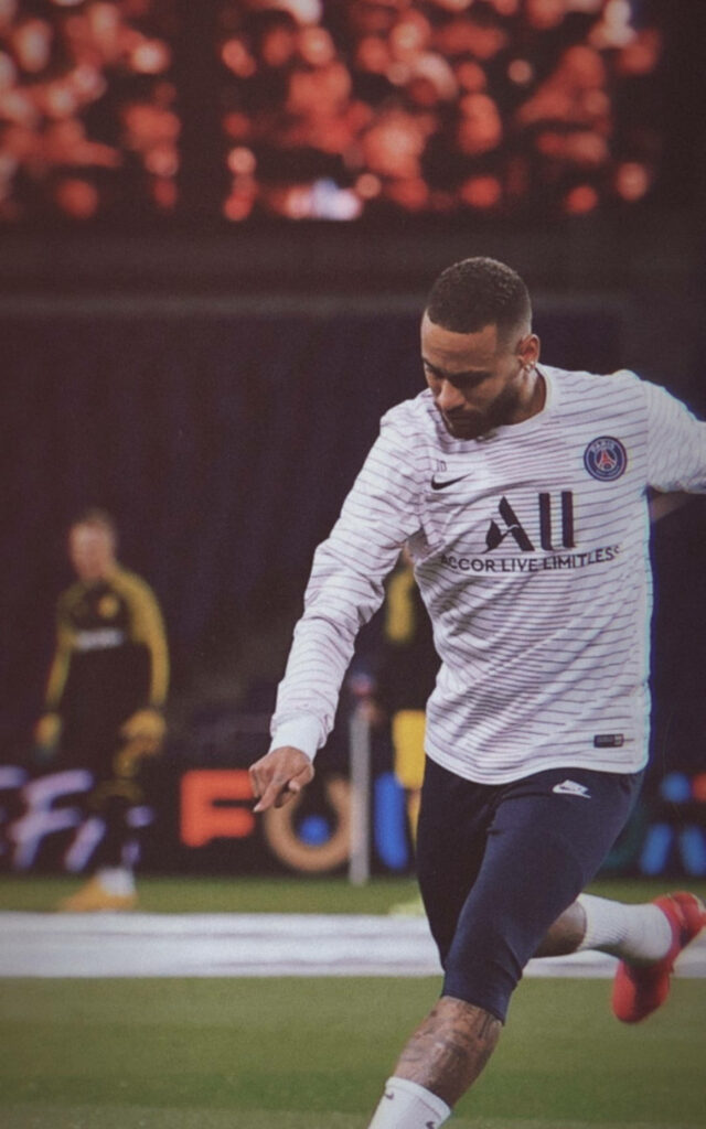 The Dynamic Neymar Jr Showcasing His Skills in Pre-match Warm-up - A Captivating Image for Neymar Jr Fans Wallpaper