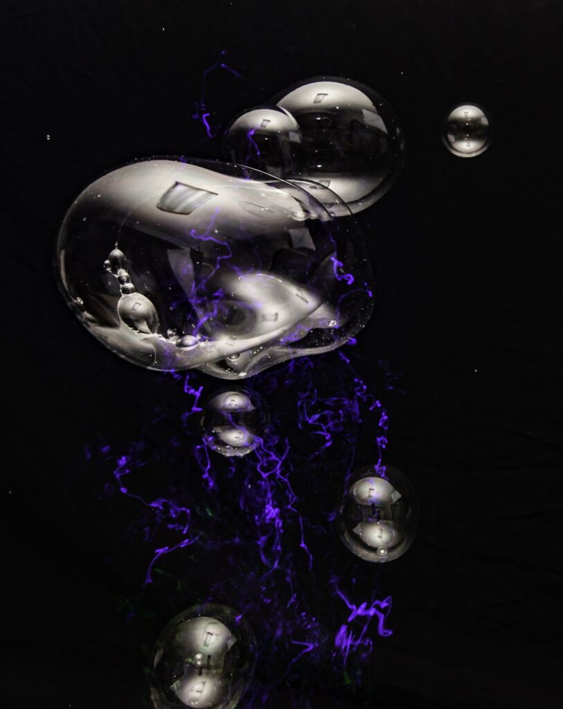 Abstract Wallpaper: Glossy Bubbles & Purple Lightning Design