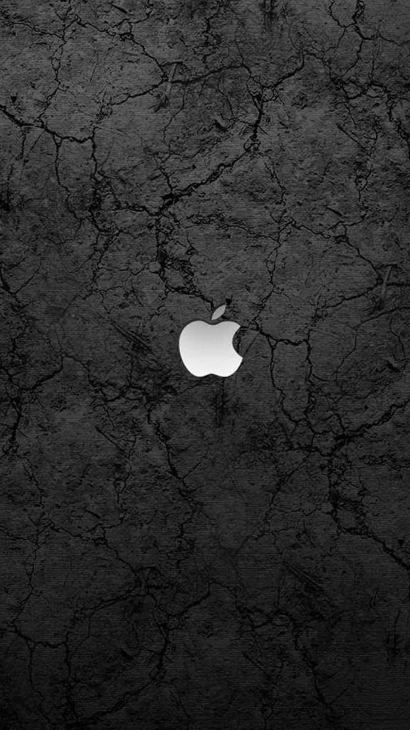 Apple logo wallpaper for iPhone with white emblem on dark cracked stone textured background