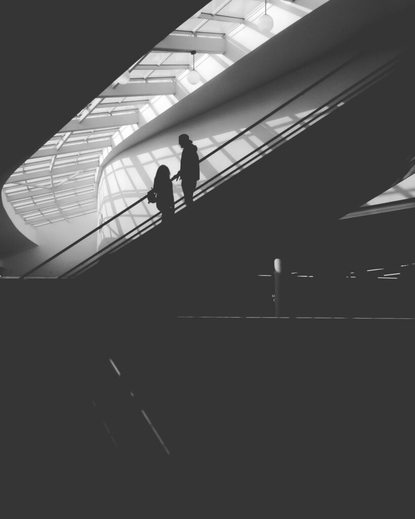 Stunning Black & White Wallpaper: Man Silhouette in Modern Architecture
