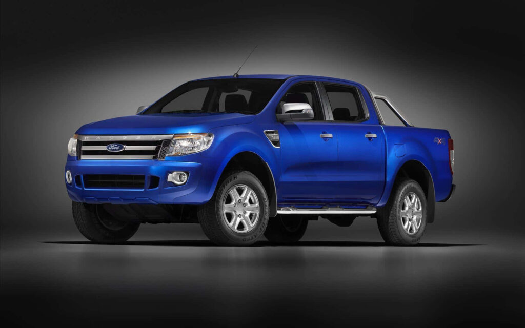 Blue Ford Ranger truck with rugged design against dark background ready for adventure wallpaper