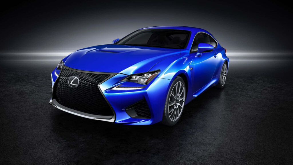 Blue Lexus RC coupe with sleek modern design on dark dramatic background wallpaper
