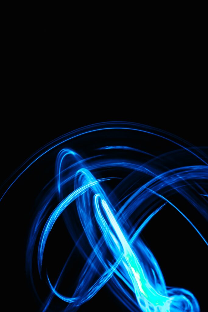 Dynamic Blue Neon Lines Wallpaper on Black Background – Long Exposure Art
