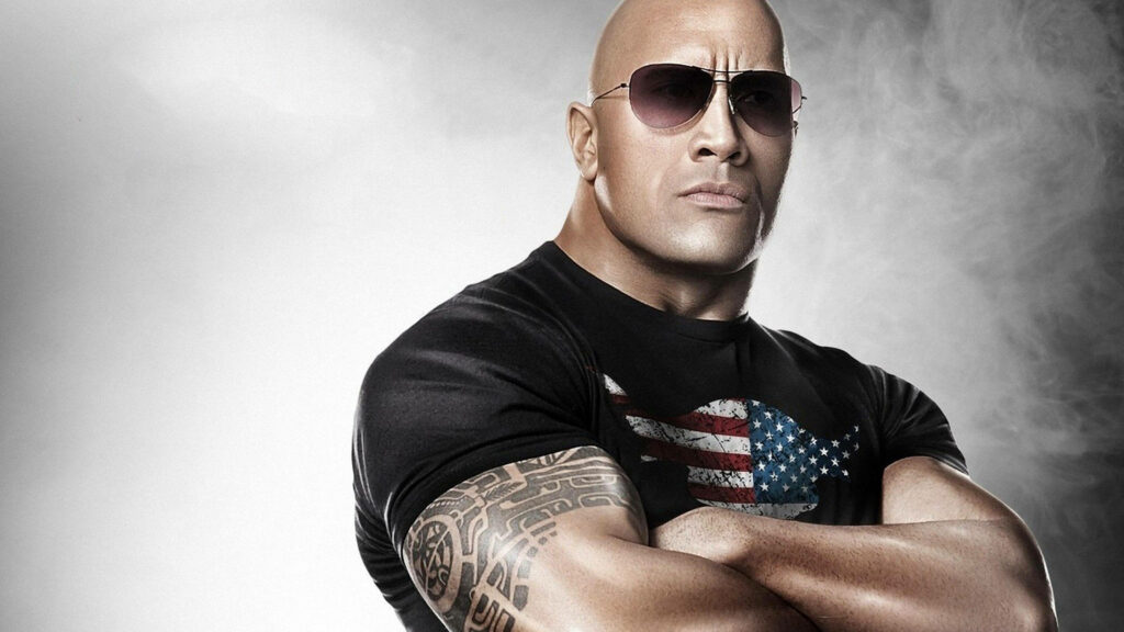 Patriotic Dwayne Johnson Wallpaper: Iconic Muscular & Confident Look