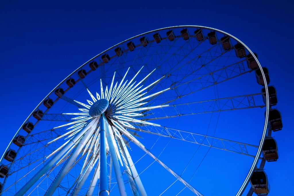 Vibrant Ferris Wheel Wallpaper: Iconic Amusement Attraction Sky View