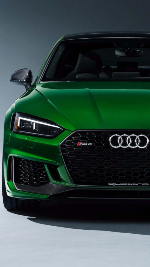 Front view of striking green Audi with sleek design and signature grille perfect wallpaper background