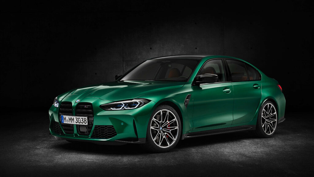Green BMW sports sedan with sleek lines against dark minimalist wallpaper background