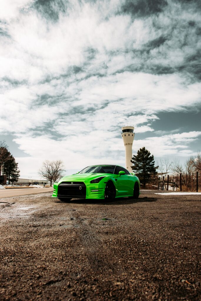 Stunning Green Nissan GT-R Wallpaper in Open Landscape Background